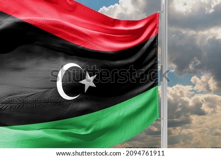 The flag of Libya was originally introduced in 1951, following the creation of the Kingdom of Libya.  Royalty-Free Stock Photo #2094761911