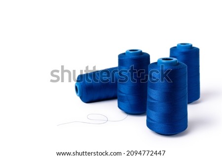 Threads of trendy electric blue isolated on white background. Copy space. Side view Royalty-Free Stock Photo #2094772447
