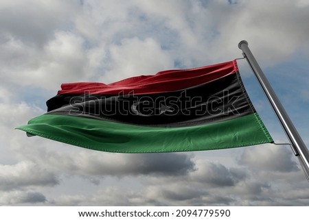 The flag of Libya was originally introduced in 1951, following the creation of the Kingdom of Libya.  Royalty-Free Stock Photo #2094779590