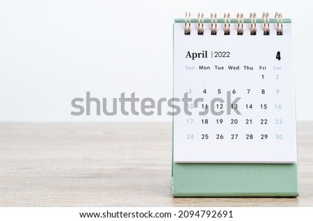 The April 2022 desk calendar on white. Royalty-Free Stock Photo #2094792691