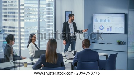 Office Conference Room Meeting: Digital Enterpreneur Presents e-Commerce Investment Strategy for Group of Investors. Wall TV Showing Big Data Analysis, Infographics, Stock Market Information, Trends Royalty-Free Stock Photo #2094798775