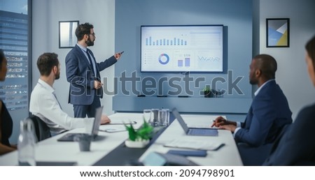 Office Conference Room Meeting: Digital Enterpreneur Presents e-Commerce Investment Strategy for Group of Investors. Wall TV Showing Big Data Analysis, Infographics, Stock Market Information, Trends Royalty-Free Stock Photo #2094798901