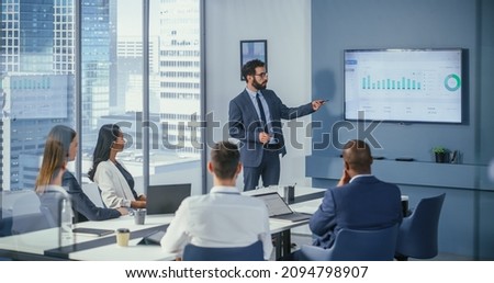 Office Conference Room Meeting: Digital Enterpreneur Presents e-Commerce Investment Strategy for Group of Investors. Wall TV Showing Big Data Analysis, Infographics, Stock Market Information, Trends Royalty-Free Stock Photo #2094798907