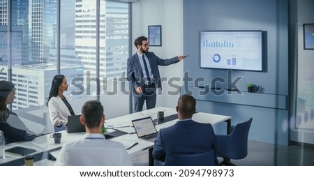 Office Conference Room Meeting: Digital Enterpreneur Presents e-Commerce Investment Strategy for Group of Investors. Wall TV Showing Big Data Analysis, Infographics, Stock Market Information, Trends Royalty-Free Stock Photo #2094798973