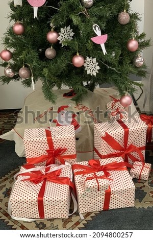 christmas gift boxes under christmas tree close up, new year and christmas holidays concept