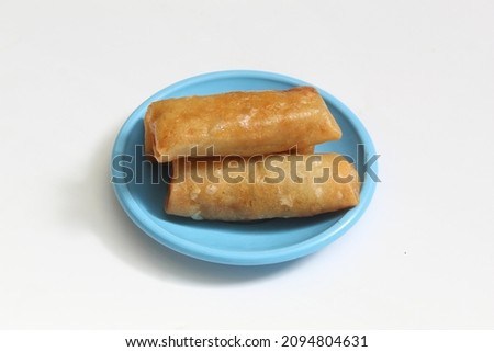 photo of fried spring rolls on a white background