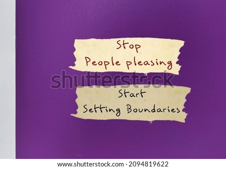 Purple wall background with text written STOP PEOPLE PLEASING - START SETTING BOUNDARIES, concept of people pleaser start to let go the need to be perfect, approval addiction and start to set boundary Royalty-Free Stock Photo #2094819622