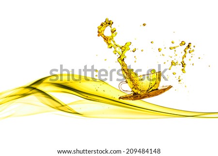 yellow splash out drink from glass on a white background.