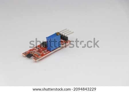 Linear hall effect sensor module for arduino and other microcontroller board projects on white background Royalty-Free Stock Photo #2094843229