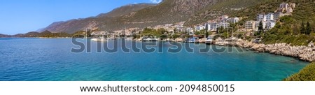 Majestic panoramic view of seaside resort city of Kas in Turkey from the sea side.  Romantic harbour with yachts and boats of Kash shoreline view. Royalty-Free Stock Photo #2094850015