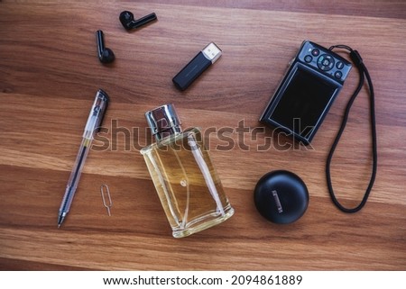 perfumes, earphones, flash drives, cameras, pens, and mobile SIM card openers
