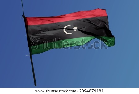 The flag of Libya was originally introduced in 1951, following the creation of the Kingdom of Libya.  Royalty-Free Stock Photo #2094879181