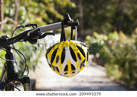 cycling helmet closeup on bicycle outdoors Royalty-Free Stock Photo #209493379