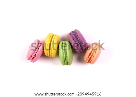 Sweet colorful macarons isolated on white background. Tasty colourful macaroons. High quality photo Royalty-Free Stock Photo #2094945916