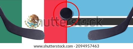 Top view hockey puck with Mexico vs. Botswana command with the sticks on the flag. Concept hockey competitions