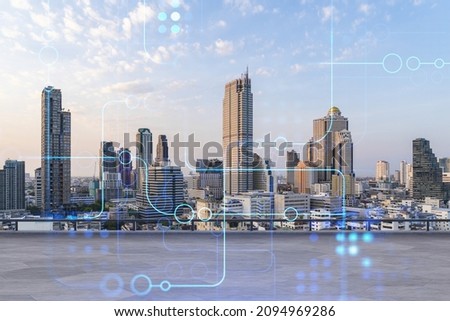 Rooftop with concrete terrace, Bangkok sunset skyline. Hi tech digital holograms to optimize business process by applying new technologies. City downtown. Double exposure.