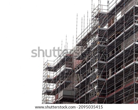Modern home of office building construction with scaffolding. White background. New house development. Construction industry. Royalty-Free Stock Photo #2095035415