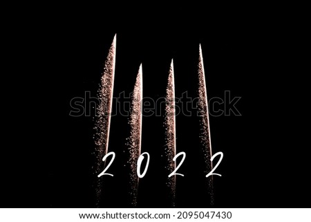 Happy new year 2022 orange fireworks rockets new years eve. Luxury firework event sky show turn of the year celebration. Holidays season party time. Premium entertainment nightlife background
