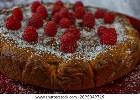 sweet potato and raspberry sponge cake with liquid caramel topped with shredded coconut