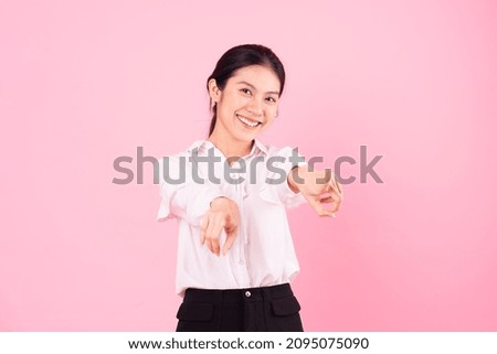 portrait of young asian businesswoman, isolated on pink background