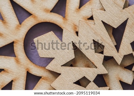 closeup of wooden textured snowflakes. christmas wooden pattern. wood carving