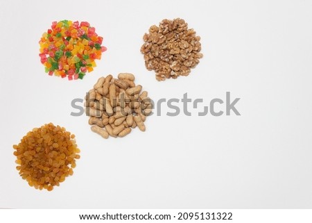 Chips, snacks, crackers and a mixture of nuts for beer on a light white background. 
