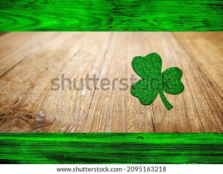 Shamrock clover on a wooden table, a symbol of the Irish holiday of St. Patrick's Day. Banner with space for text. Selective focusing.