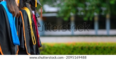 graduates wearing black hats holding certificates university graduation certificates,Concept education congratulation. Graduation Ceremony ,Congratulated the graduates in University.