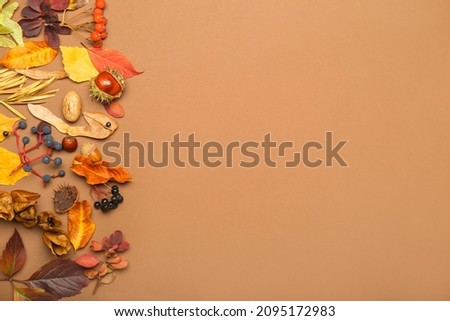 Beautiful autumn composition with fallen leaves on color background, closeup