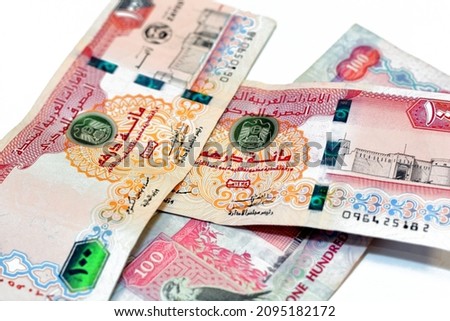 Obverse side of 100 AED one hundred Dirhams banknote of United Arab Emirates, currency of the UAE with a picture of Al Fahidi Fort and Centenary of UAE Founding Father Sheikh Zayed isolated on white