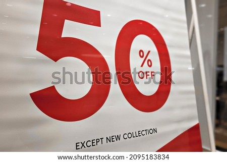 Close up seasonal sale 50% off, holiday discounts in shopping mall, Black Friday.