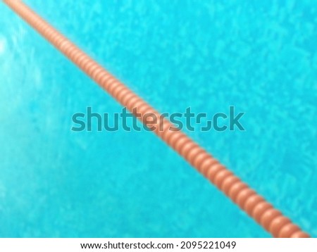 Swimming pool and lane rope, blurry