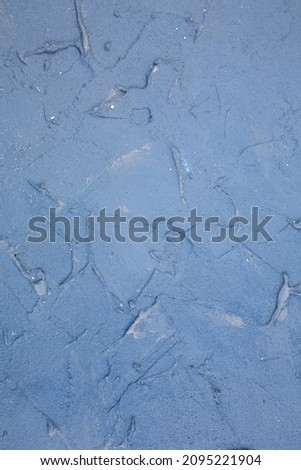 Concrete texture as a background. Blue stucco wall,  vertical  picture.