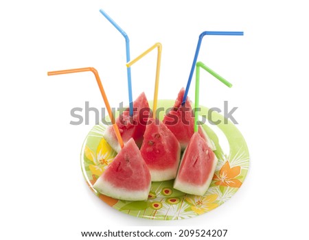 Ripe watermelon to pieces with a tubule on the plate isolated