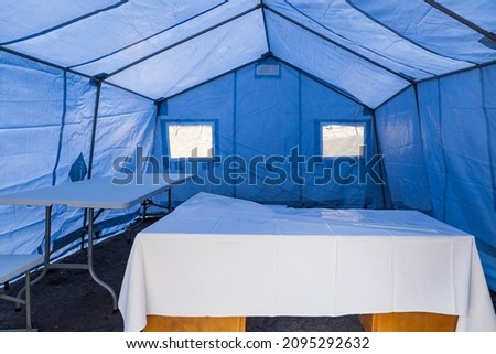 Inside a medical tent for rapid COVID-19 testing and vaccination of the population. Background