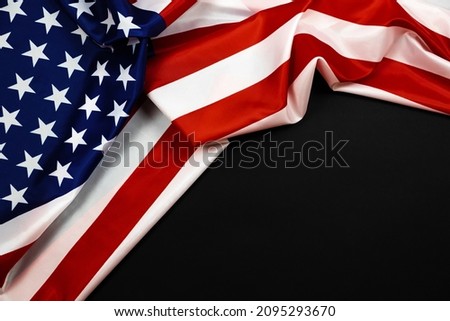 American flag for Memorial Day, 4th of July or Labour Day. USA flag on black background, copy space, top view