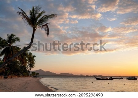 Beautiful scene of seascape during the Sunrise time. Very nice clouds and sun light at the beautiful beach of Thailand.