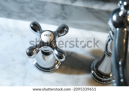 Chrome Faucet Handle in a Residencial Bathroom Royalty-Free Stock Photo #2095339651