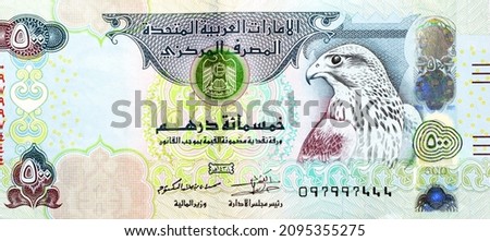 Large fragment of obverse side of 500 AED five hundred Dirhams banknote of United Arab Emirates, currency of the UAE with a picture of Sparrow hawk at right, selective focus of Emirates money banknotes Royalty-Free Stock Photo #2095355275
