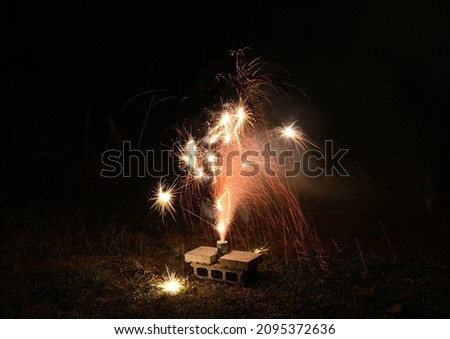 Fireworks spouting in the garden of a Japanese home