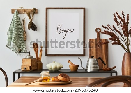 Creative dining room interior design with mock up poster frame, family dining table, black console and retro inspired personal accessories. Copy space. Template. Autumn vibes.
