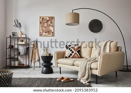 Stylish composition of elegant living room interior design with mock up poster frame, metal and wooden shelf, sofa, vintage vases and personal accessories. White wall. Copy space. Template. Royalty-Free Stock Photo #2095383952