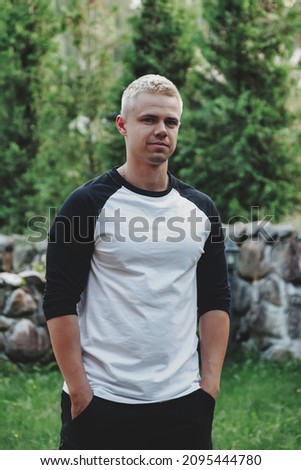 Portrait of trendy cute young businessman in outdoor rural. Attractive man in home casual clothes walking in rural country. Creative inspiration and startup business. Copy space