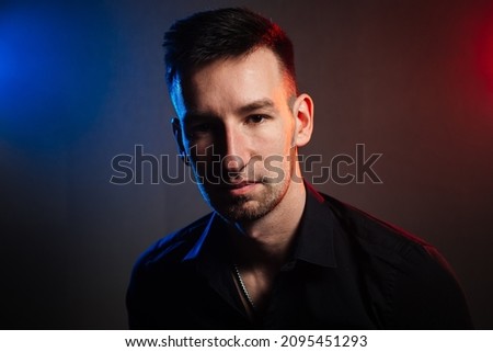 handsome man portrait with colored reflexes. color filters