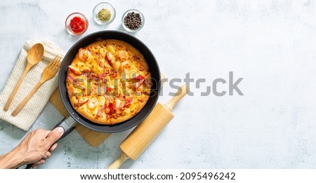 Pizza,Delicious pepperoni pizza and basil tomato cooking ingredients on black concrete background, top view of hot pepperoni pizza. With copy space for text lay flat, banner