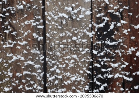 Background of a wooden wall in the snow