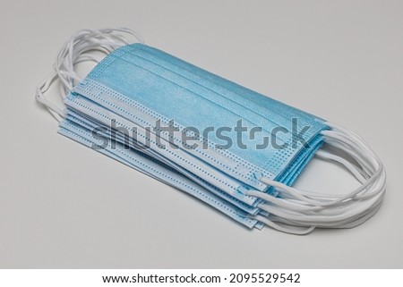 stack of medical protective masks on white background. High quality photo