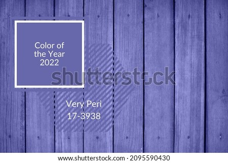 Background old wooden boards with nails colored in Very Peri color 2022 with square frame. Trendy concept.