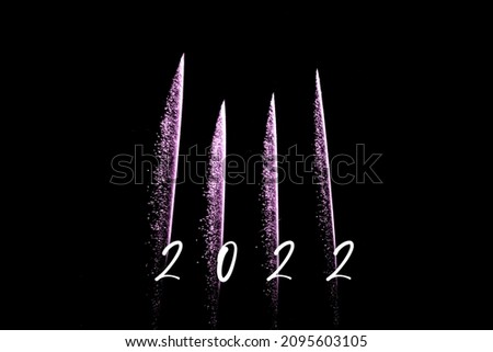Happy new year 2022 pink fireworks rockets new years eve. Luxury firework event sky show turn of the year celebration. Holidays season party time. Premium entertainment nightlife background
