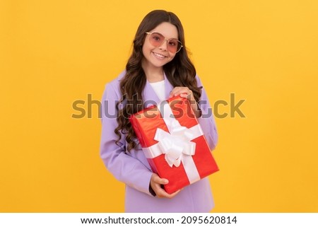 shopping time. cheerful kid hold present. child prepare for holiday. happy valentines day